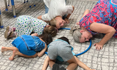 children and teacher in an activity