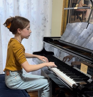 girl playing piano