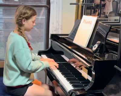girl playing piano