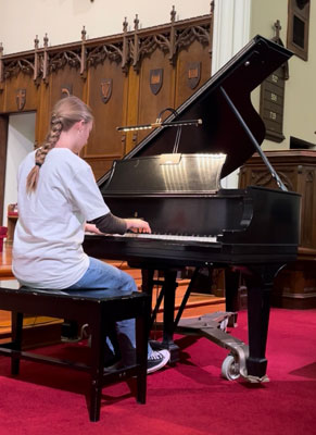 girl playing piano